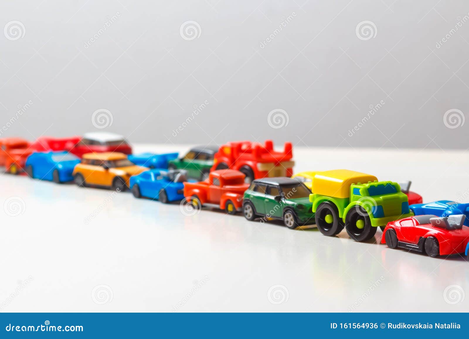 Plastic Multi Colored Toy Cars Are Lined Up On A White Background Stereotypical Alignment Of Subjects Is A Sign Of Autism Stock Photo Image Of Plastic Dioxide Plastic Multi Colored Toy Cars Are Lined Up On A White Background Stereotypical Alignment Of Subjects Is A Sign Of Autism Stock Photo Image Of Plastic Dioxide
