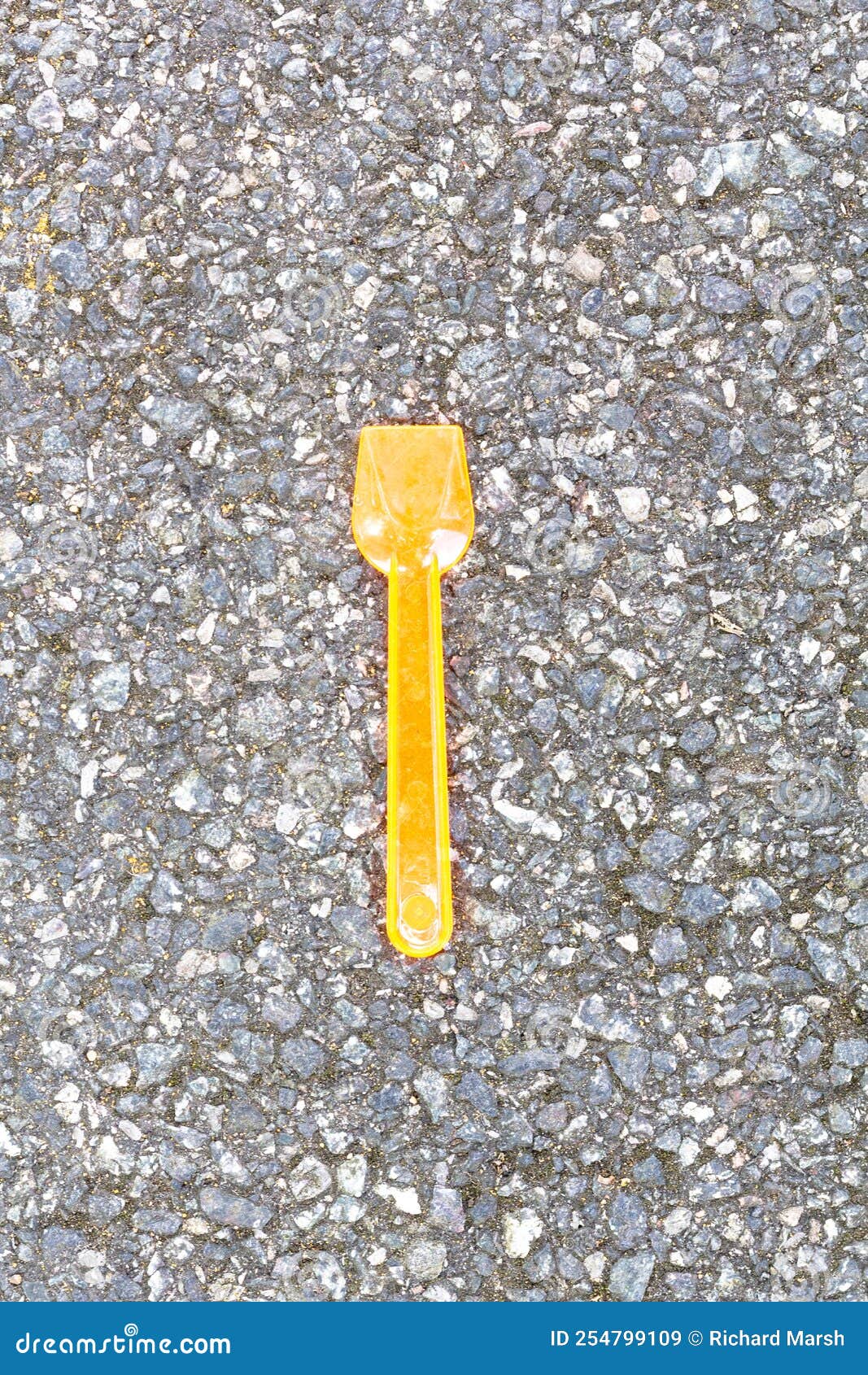 Plastic Orange Ice Cream Spoon on Tarmac Stock Image Image of spoon