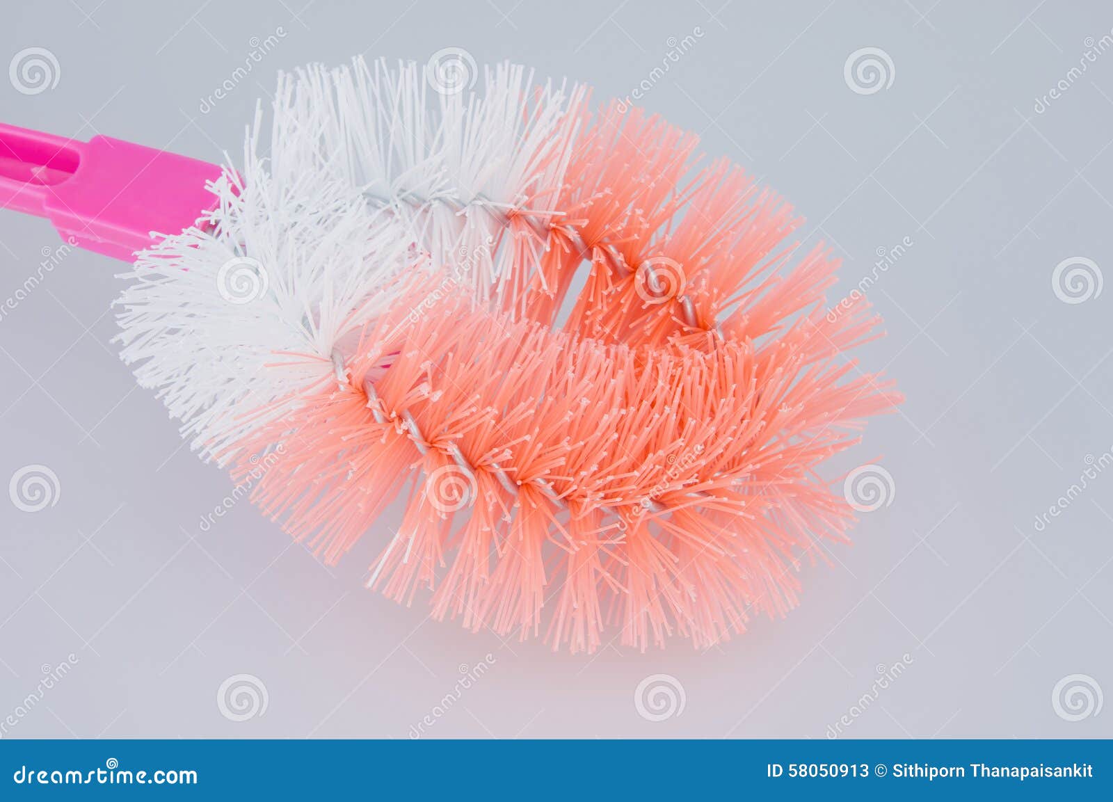 Plastic Orange and White Toilet Brush on White Background Stock Image