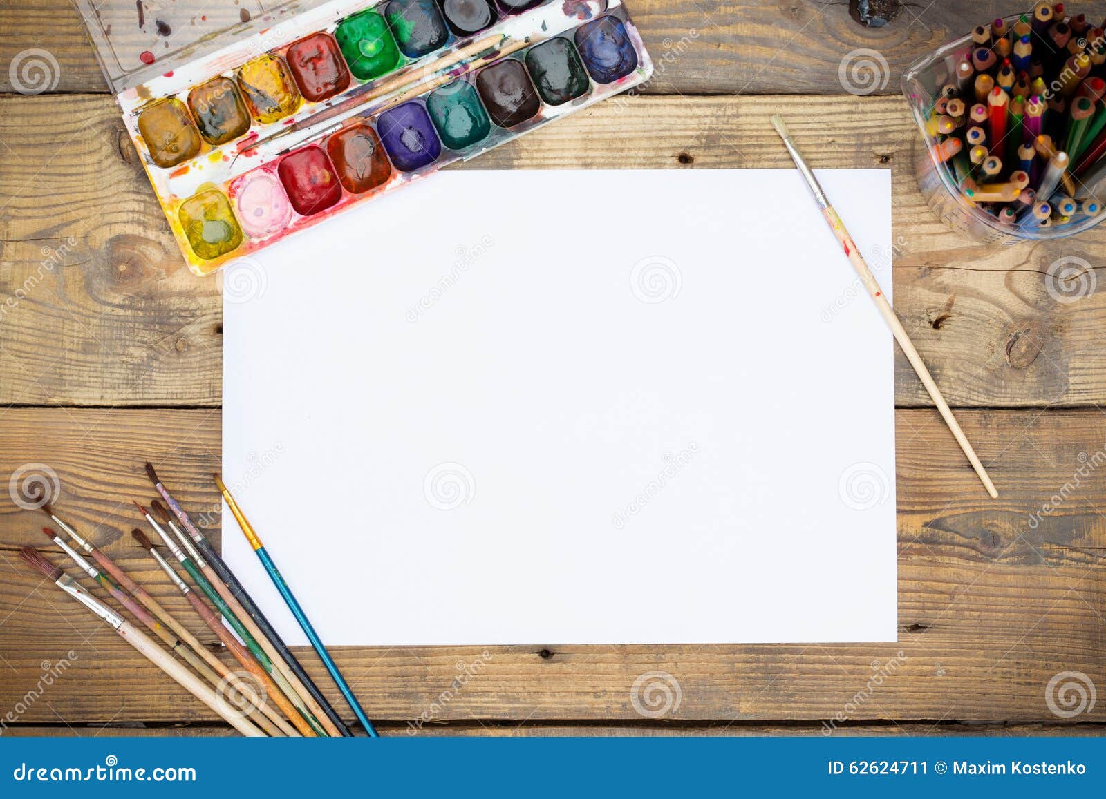 Plastic Paint Palette with Paint and Brushes on Wood Stock Image
