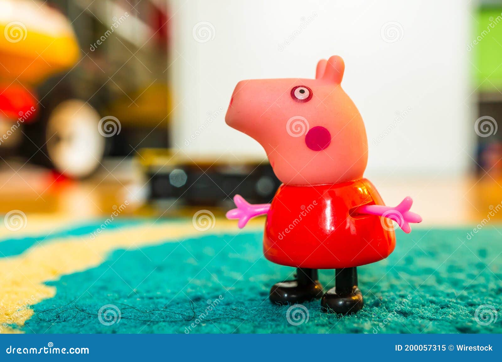 A plastic Peppa Pig toy play house standing on a table Stock Photo