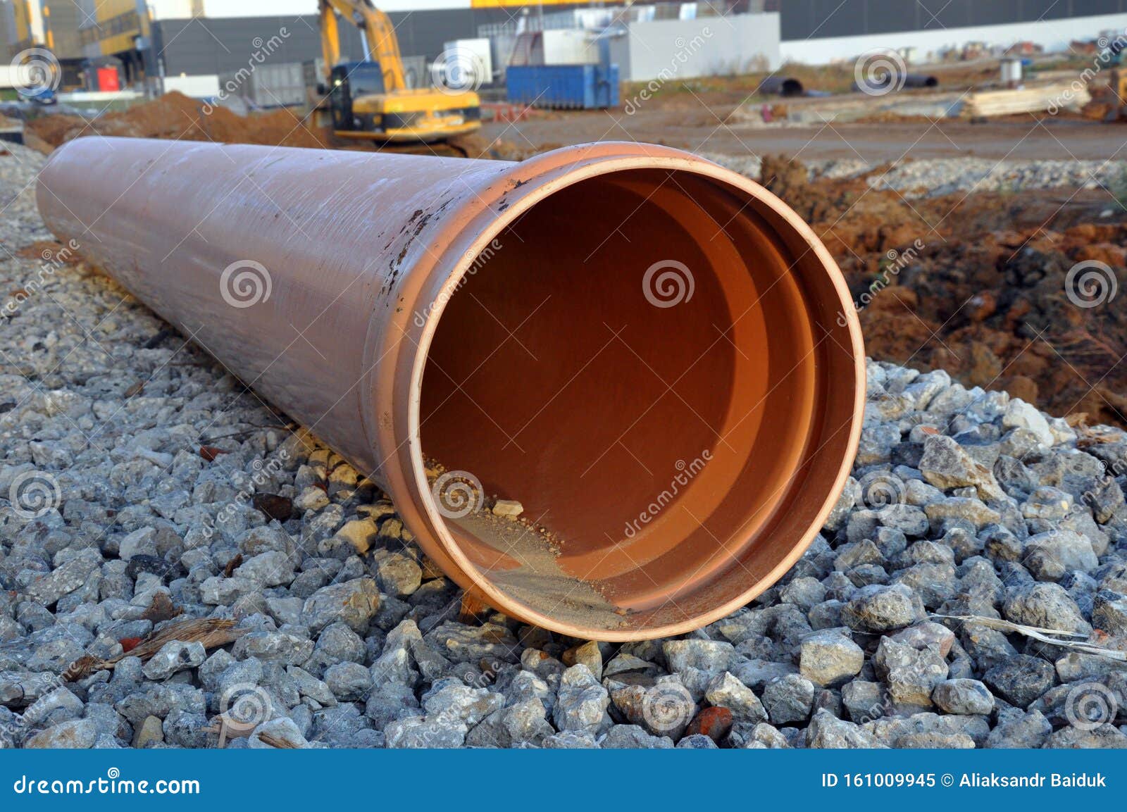 A Plastic Pipe Lying On The Territory Of The Construction Site For The