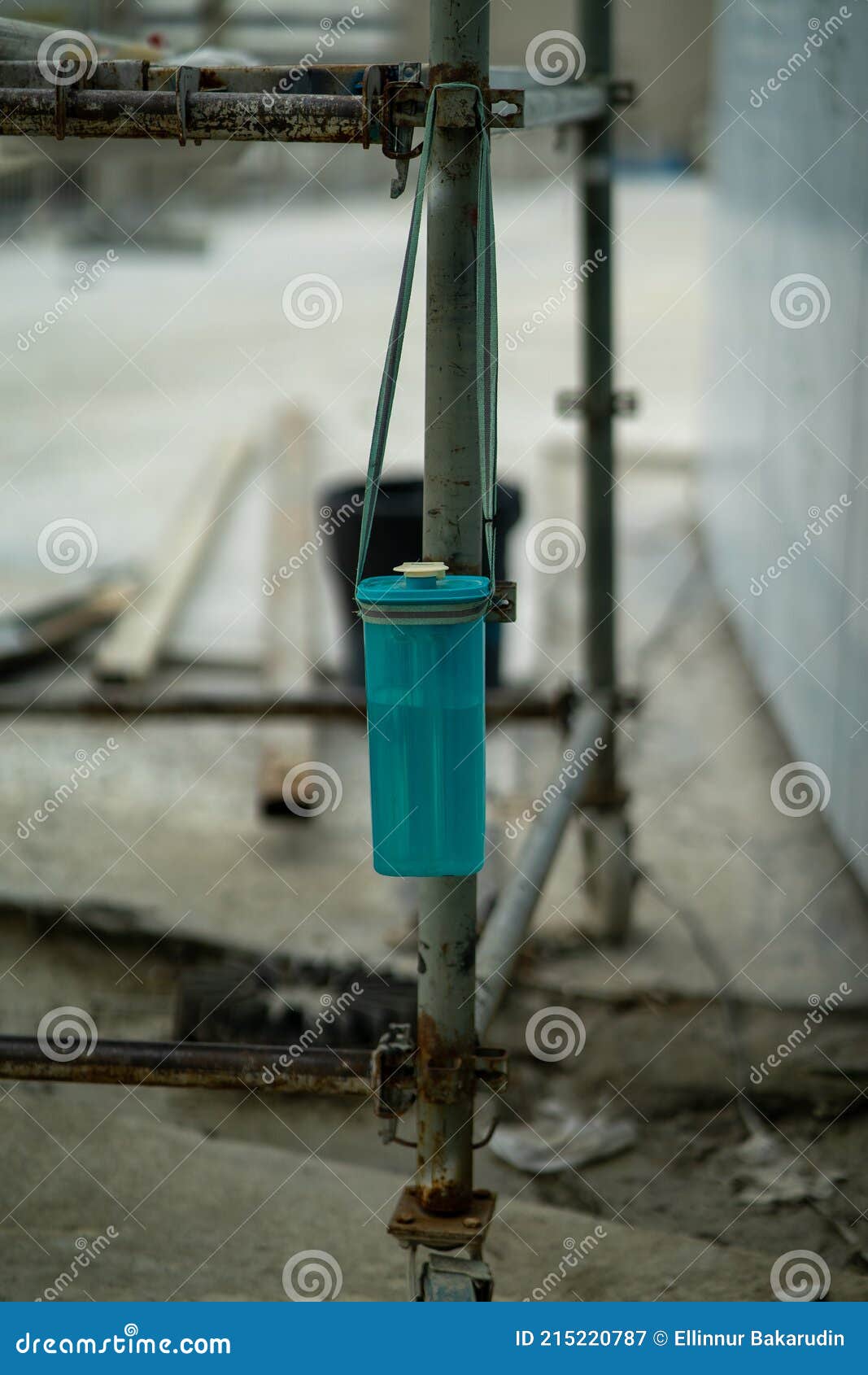 Plastic Reusable Water Bottle Hanging at a Construction Site Stock