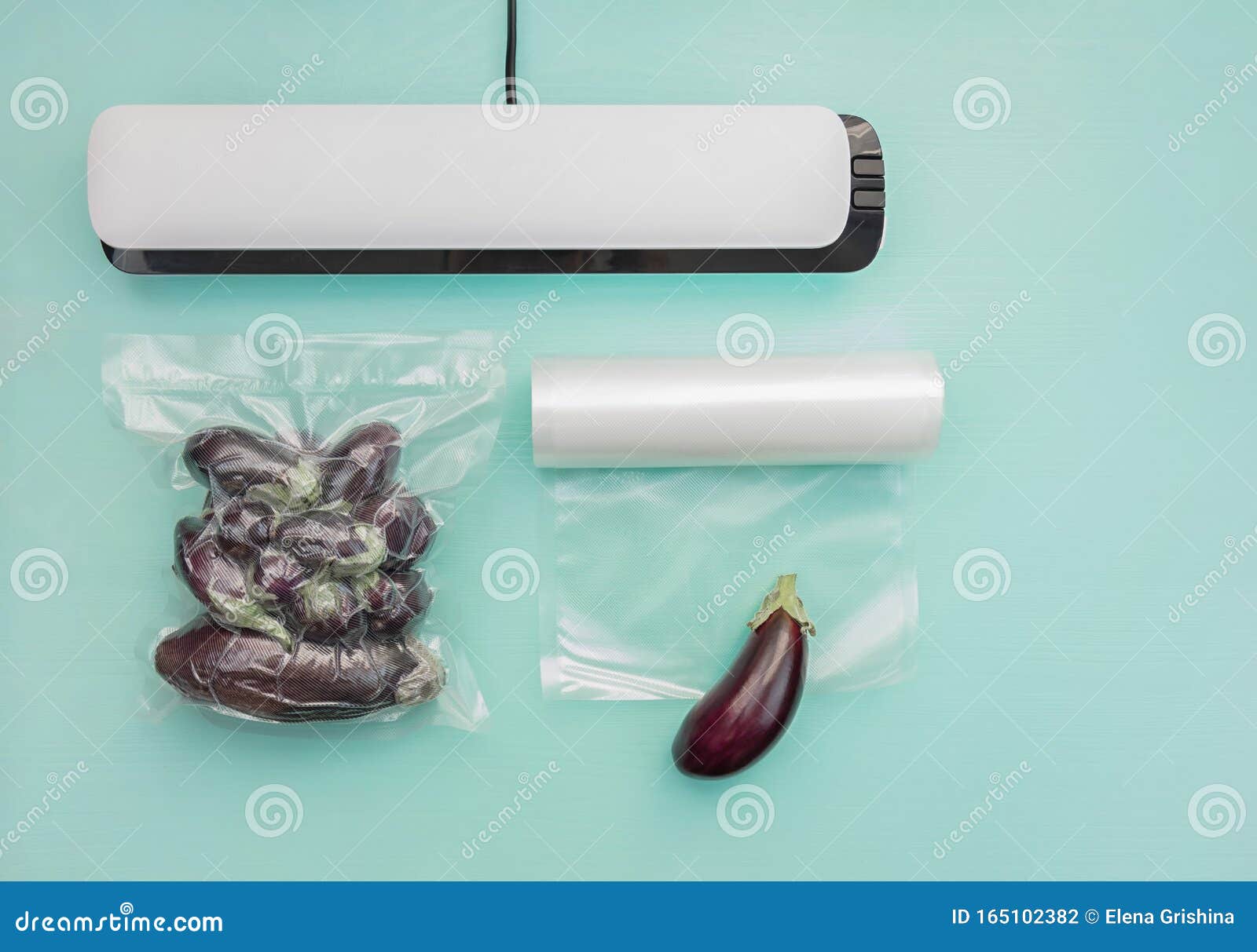 Plastic Sealing Machine. Vacuum Packaging of Fresh Tomatoes Stock Photo