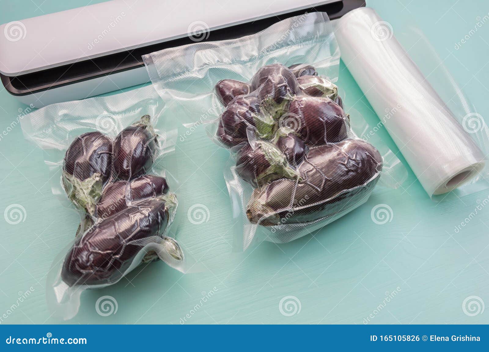 plastic sealing machine vacuum packaging fresh tomatoes eggplant storage long term close up 165105826