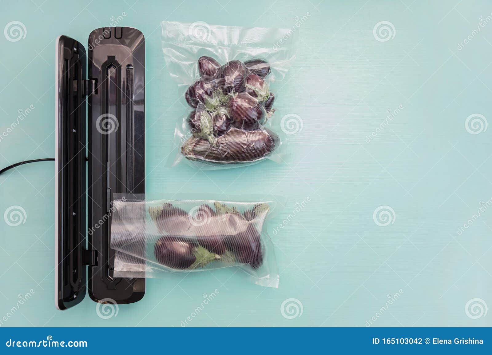 Plastic Sealing Machine. Vacuum Packaging of Fresh Tomatoes. Vacuum