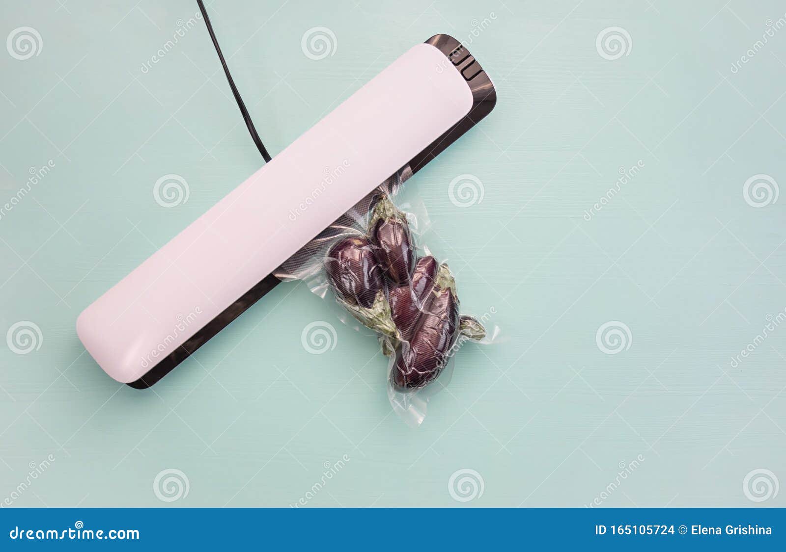 Plastic Sealing Machine. Vacuum Packaging of Fresh Tomatoes. Vacuum