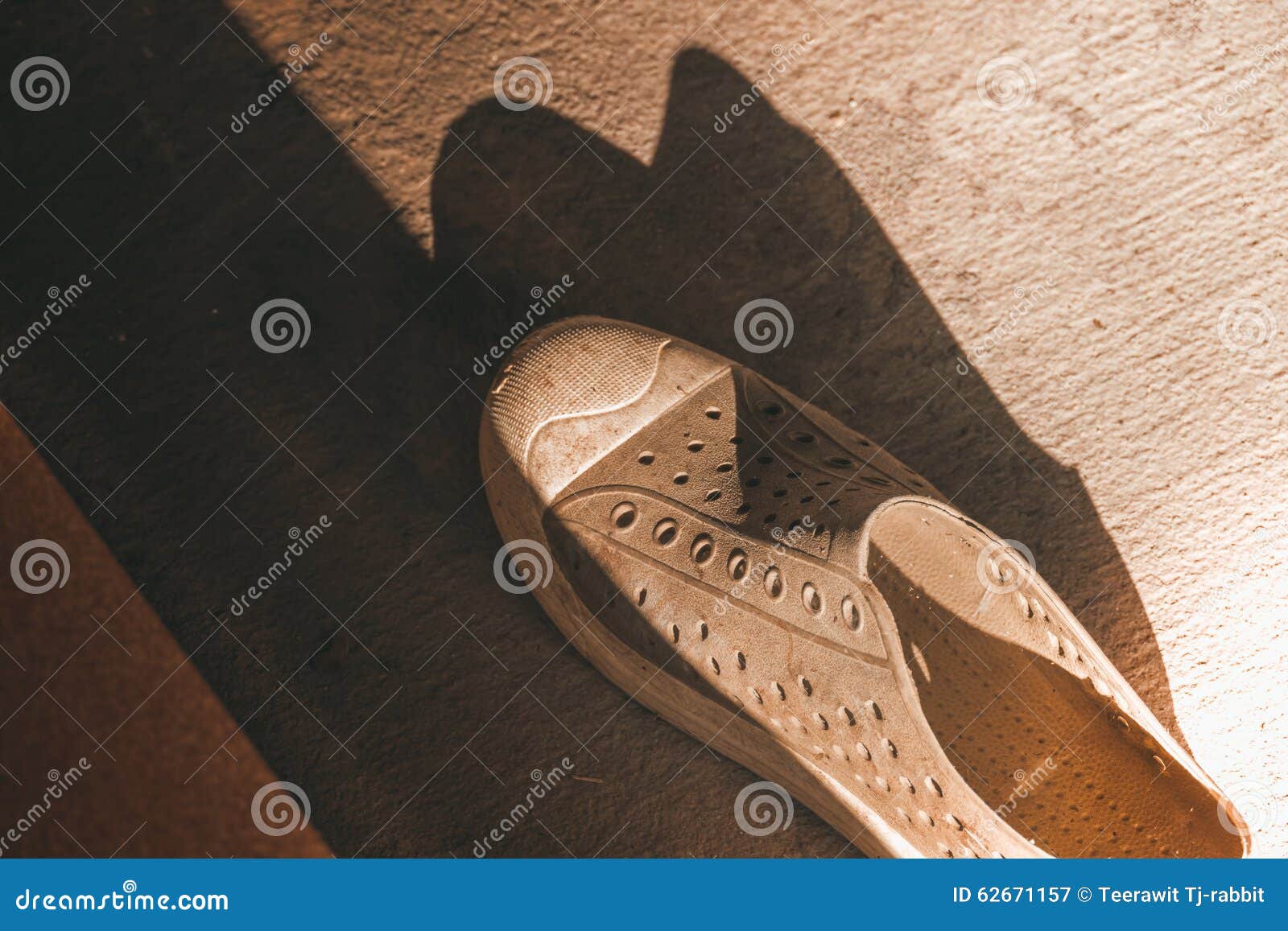 Plastic Shoes on Tile Background with Copy Space Stock Image - Image of ...