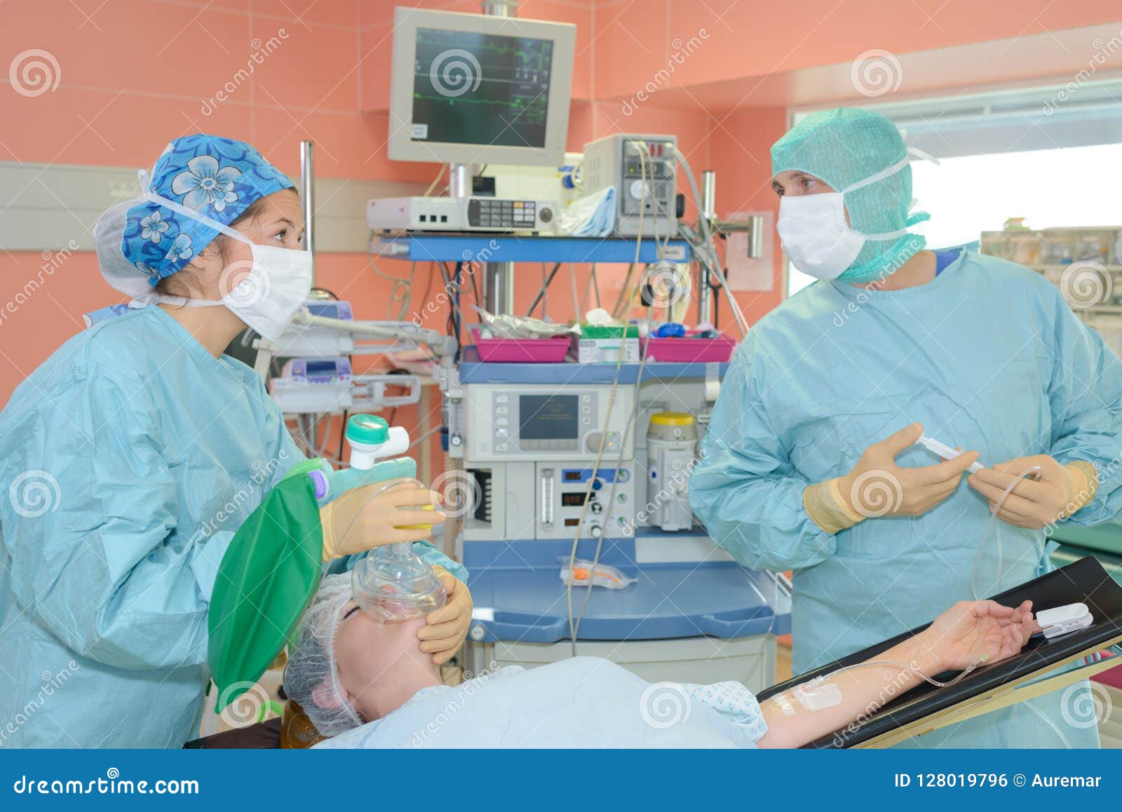 Plastic surgeons at work stock photo. Image of face 128019796