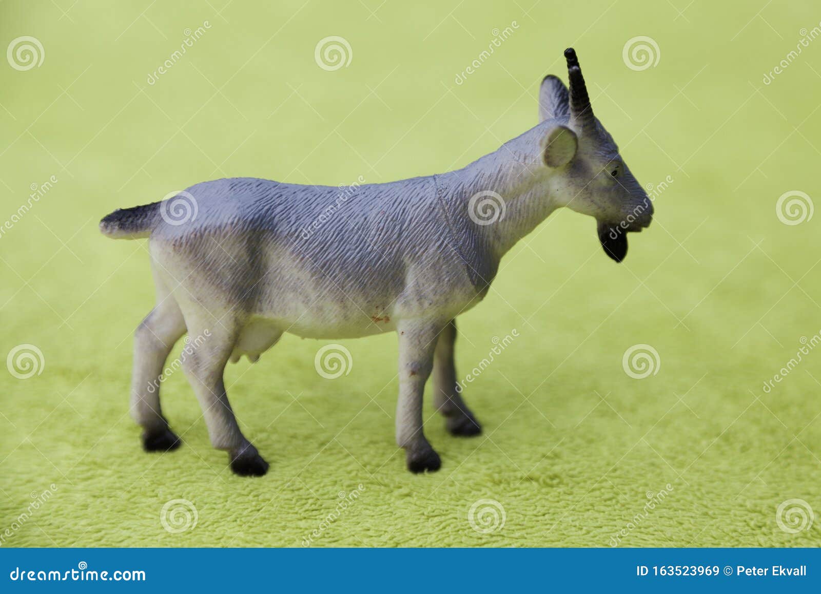 Plastic Toy Animal, A Goat On Green Background Stock Image Image of