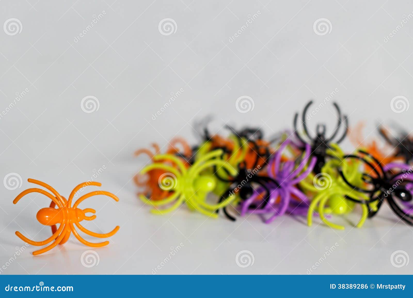 Plastic toy spider rings stock photo. Image of closeup