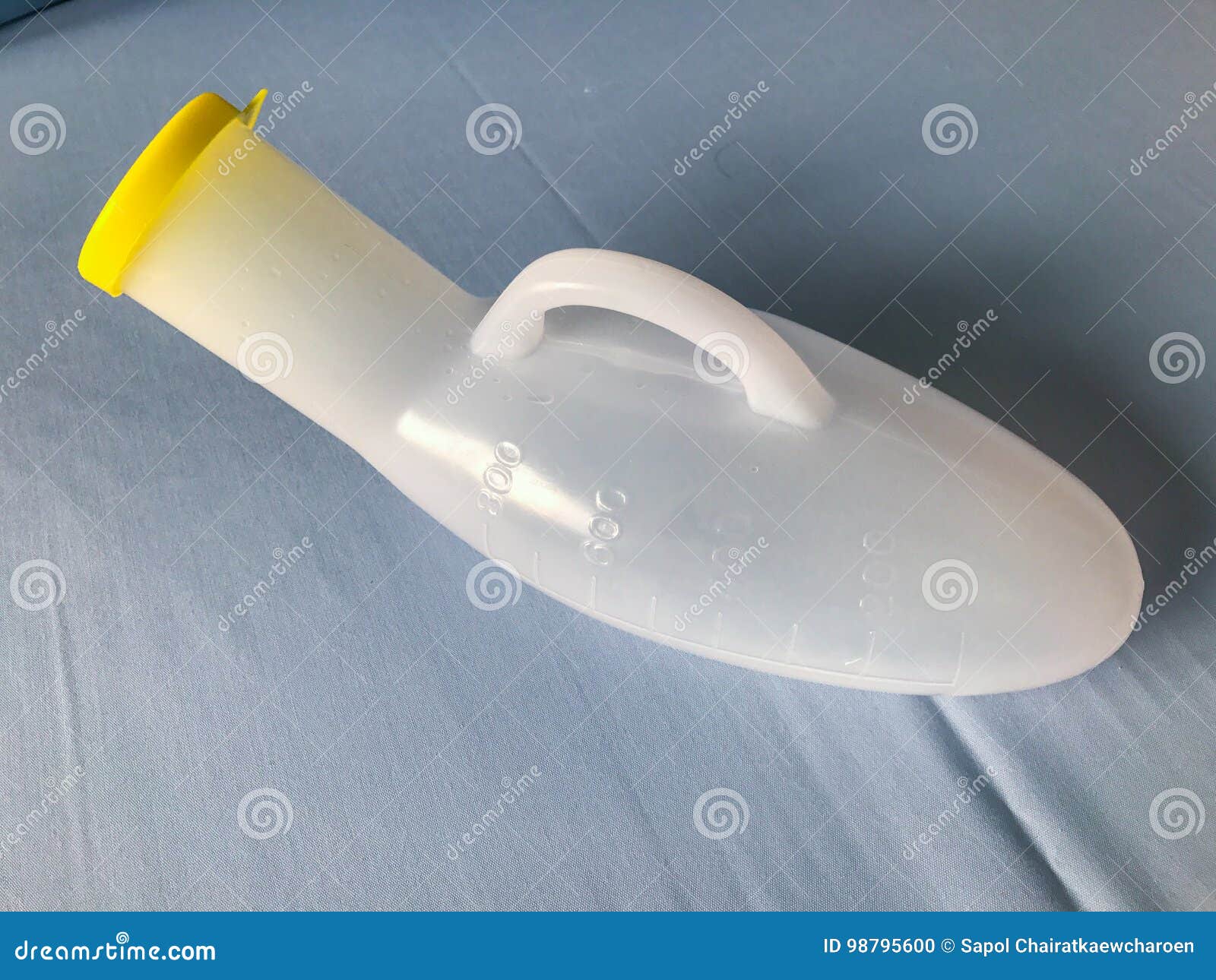 Plastic Urinal of Man with Blue Light Background in Hospital Stock