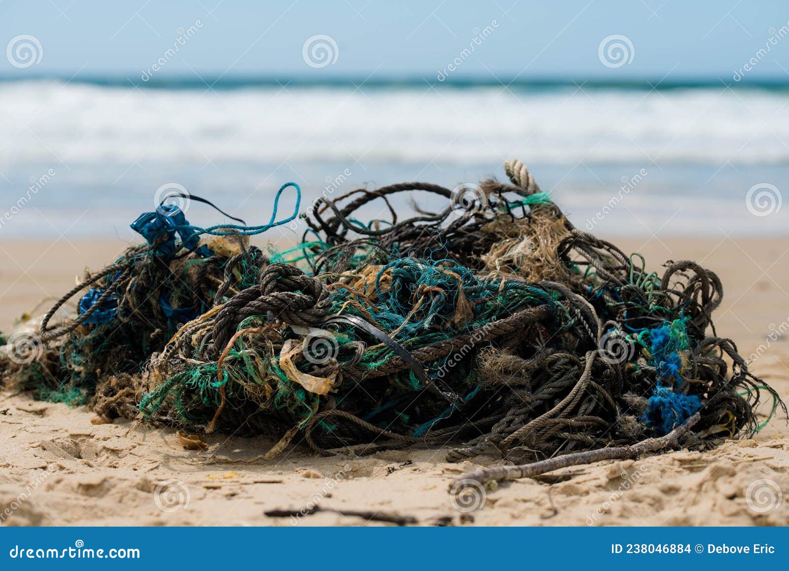 Plastic Waste and Fishing Nets Washed Up by the Ocean on the Beach Stock  Photo - Image of close, fishing: 238046884