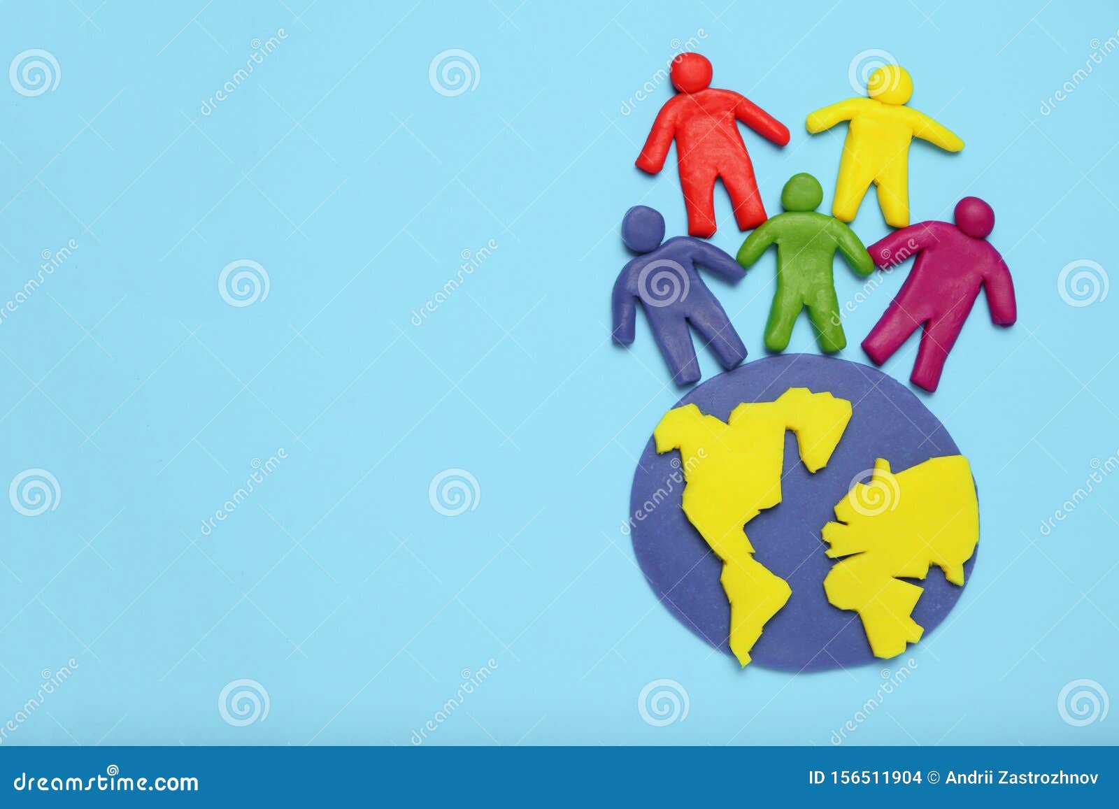 plasticine multicolored cartoon people on globe. the use and depletion of the planet earth, overpopulation and population growth