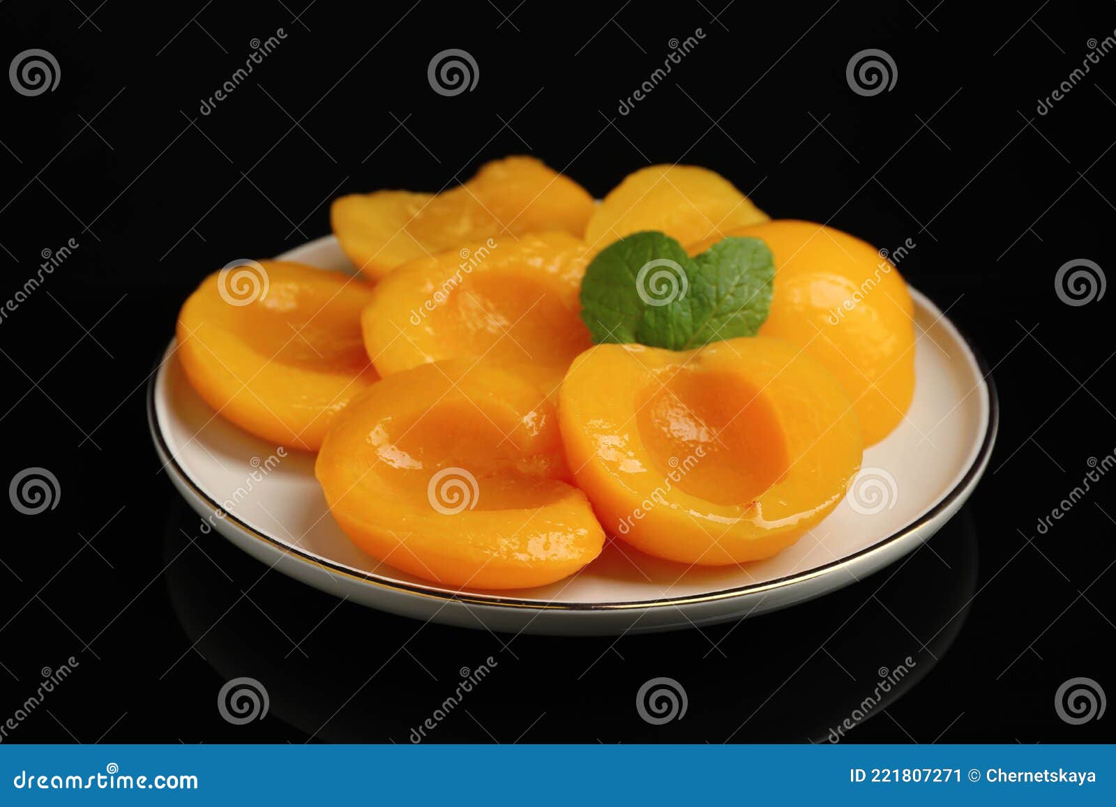 Plate with Canned Peach Halves on Black Background Stock Image Image