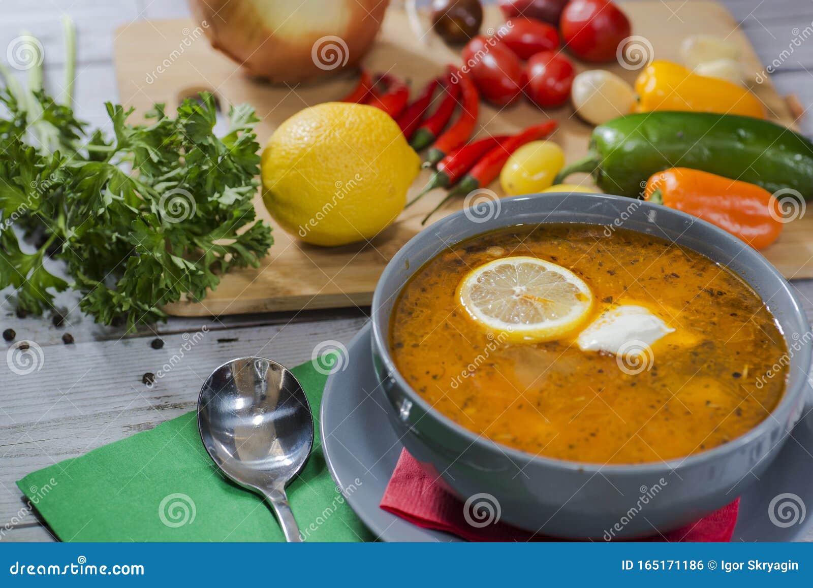 plate with solyanka with vegetables on the table