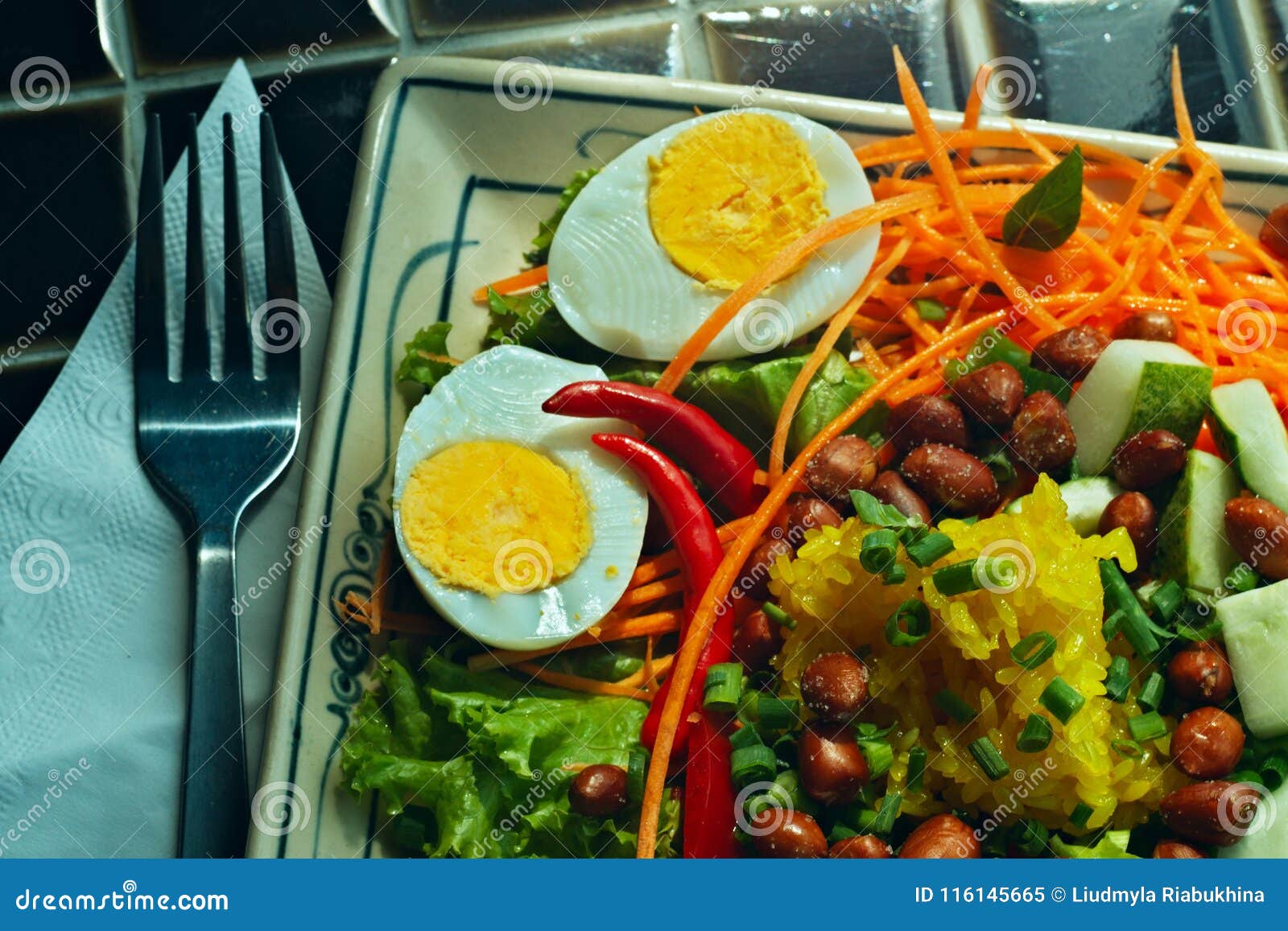 plate of colorful vegetables and boiled eggs close-up