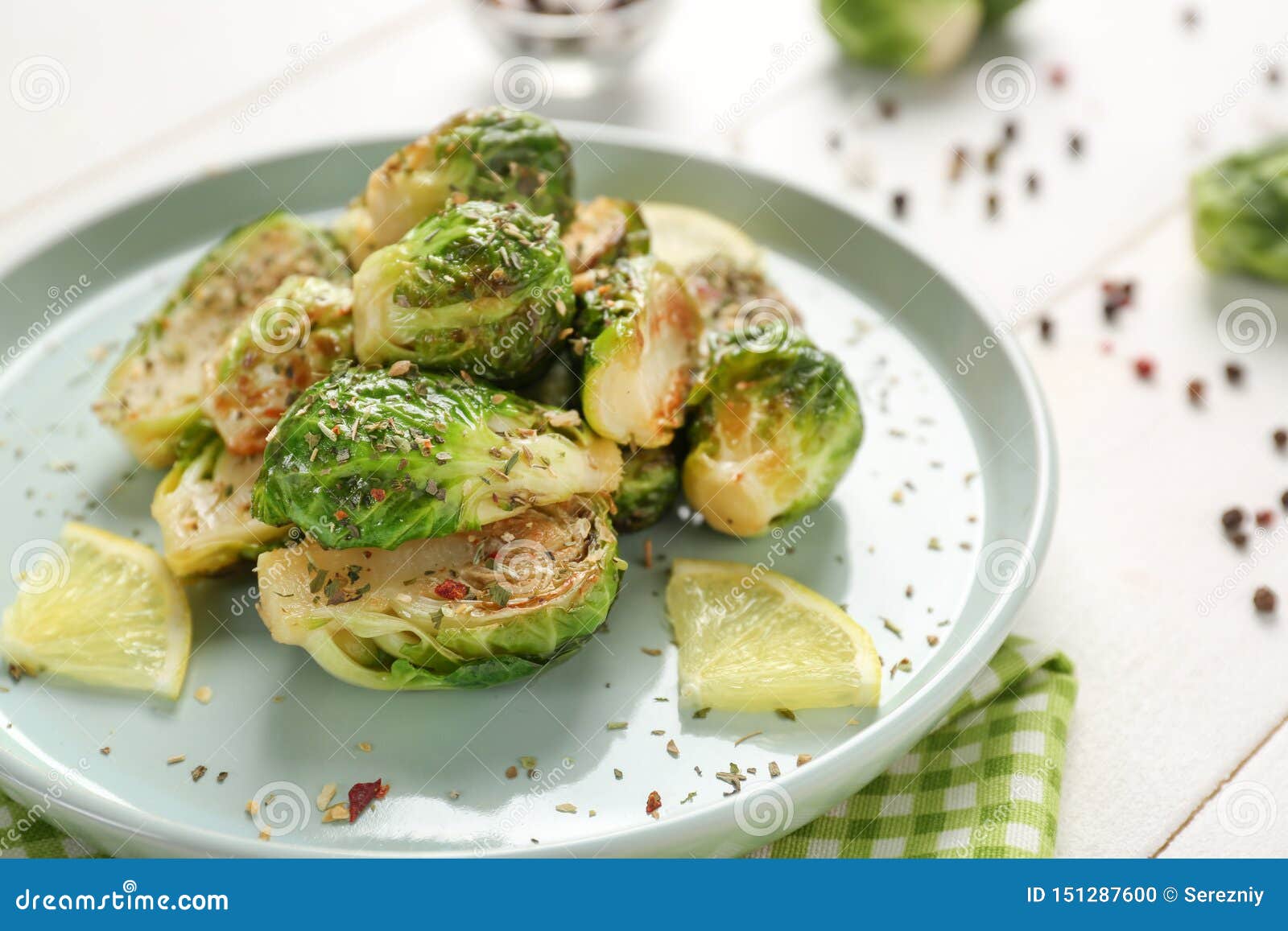 Plate with Delicious Roasted Brussels Sprouts on Table, Closeup Stock