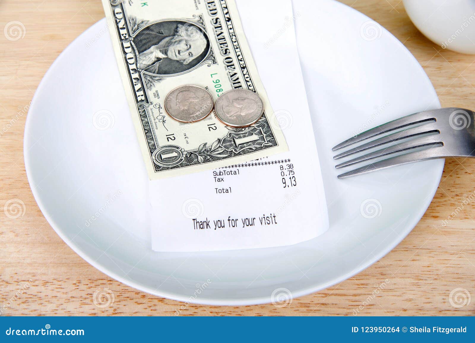 gratuity tip on a plate