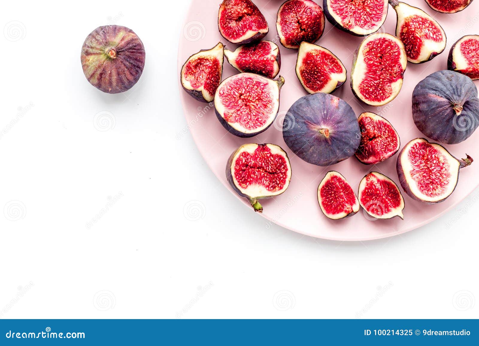 Plate of Fresh Blue Figs on White Background Top View Copyspace Stock