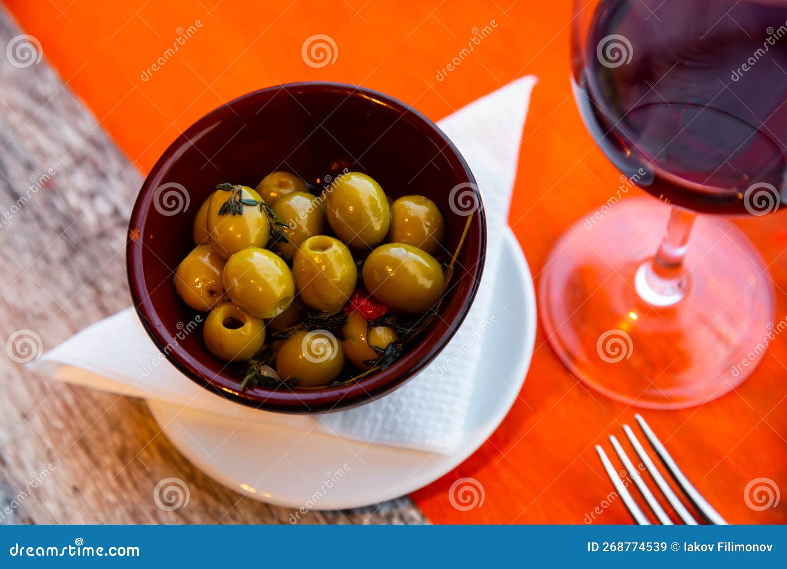 plate of pickled green olives without stone, spanish appetizer - olivas verdes sin hueso