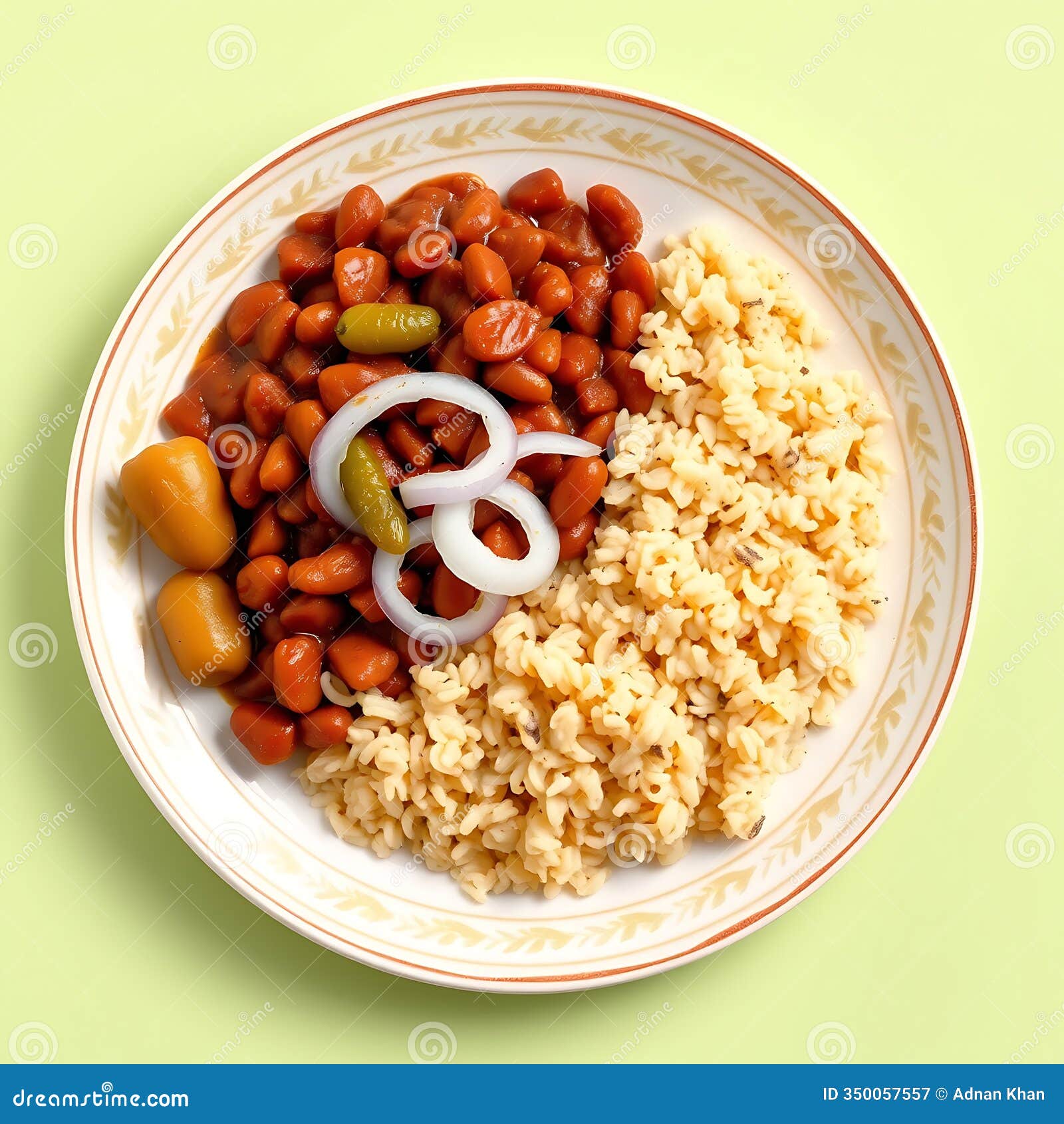 a plate of rajma chawal with onions and pickles on a pastel green background