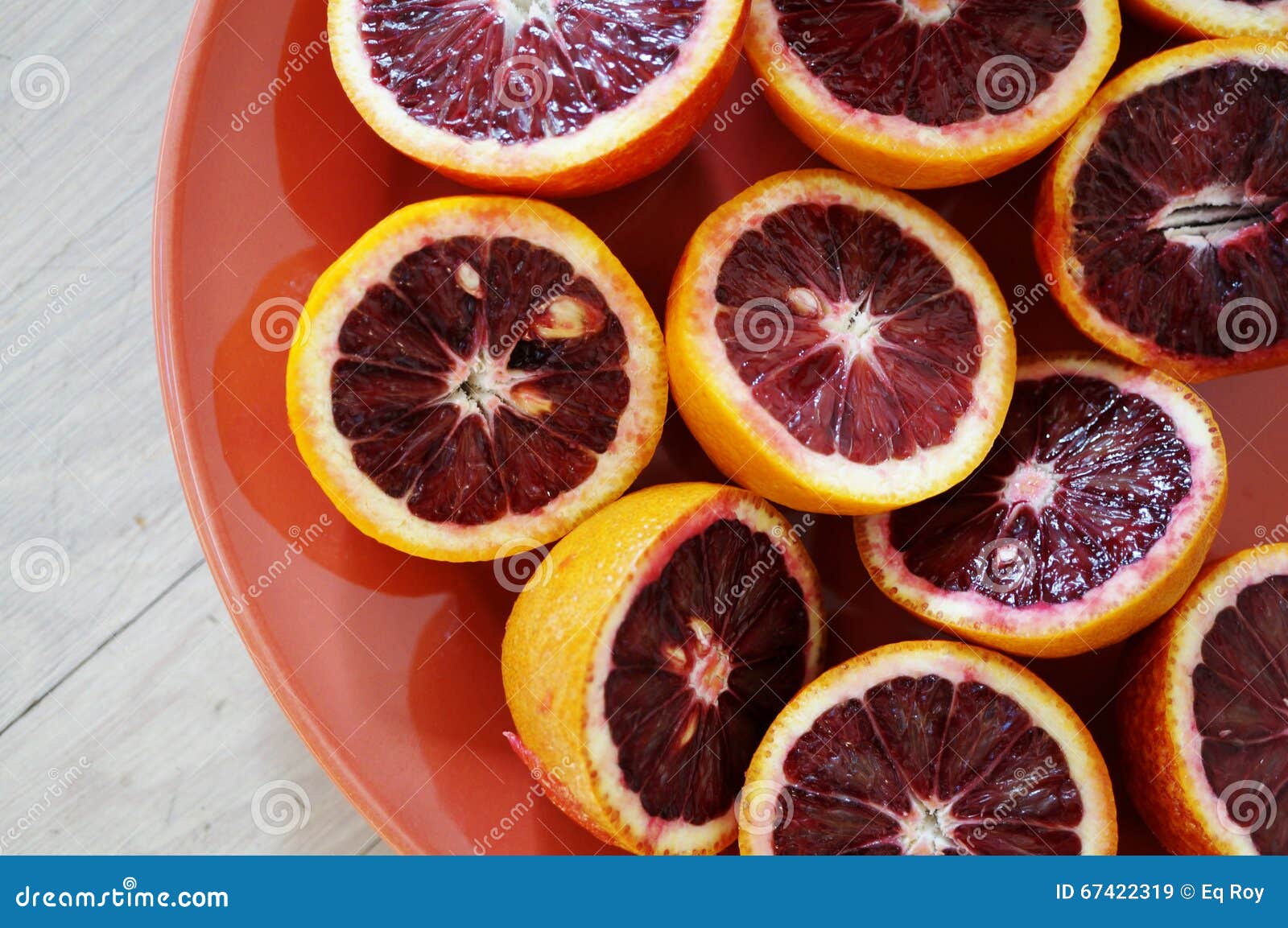 Ruby Red Blood Oranges, Navel Oranges, And Clementines Cut In Half