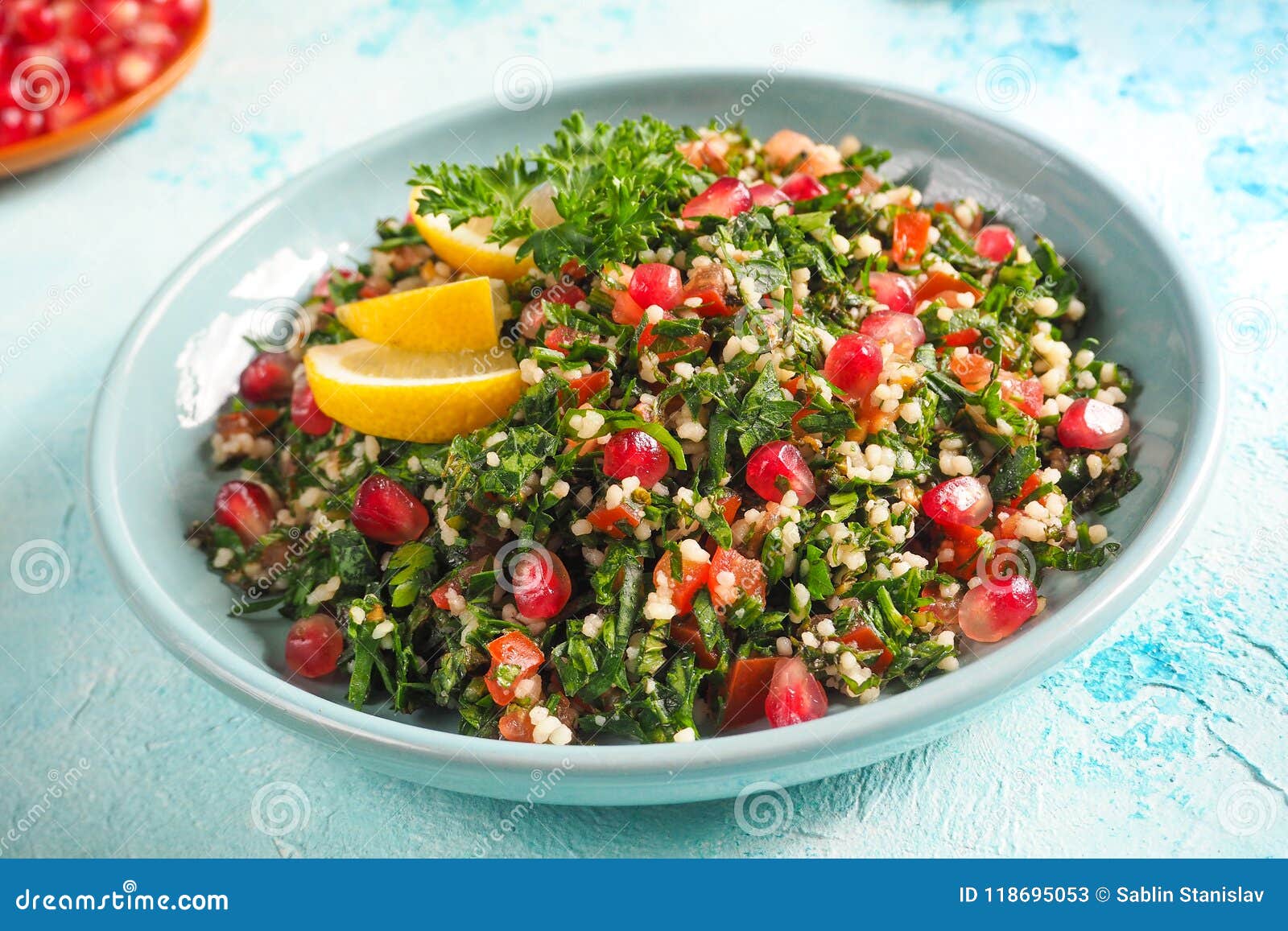 a plate of tabbouleh salad, close-up. traditional arabic food.