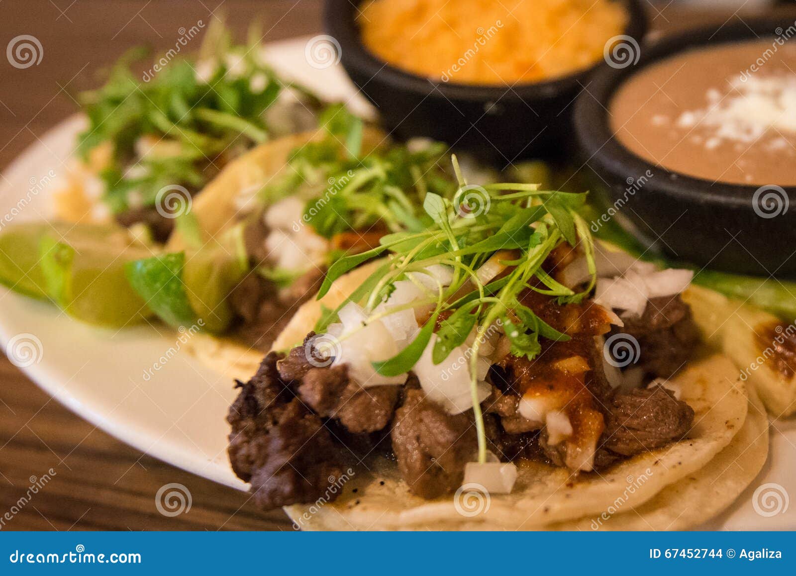 plate of three street style tacos