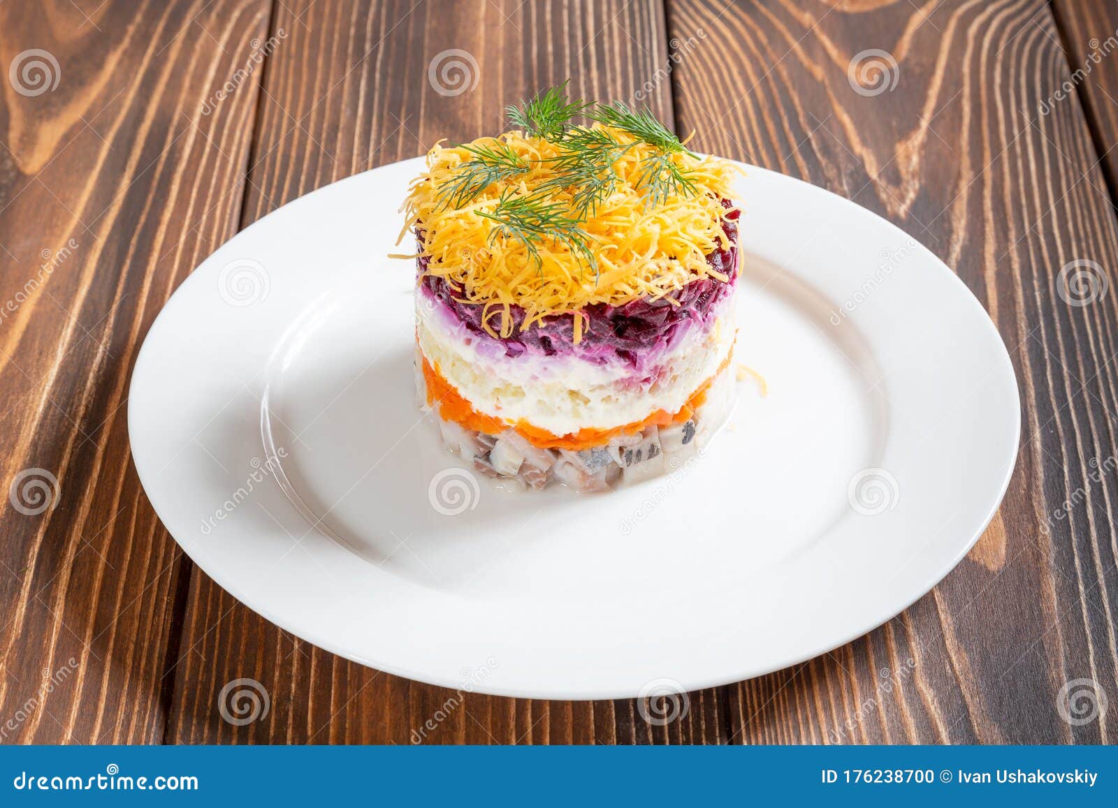 Plate of Traditional Russian Salad Called Dressed Herring Stock Photo