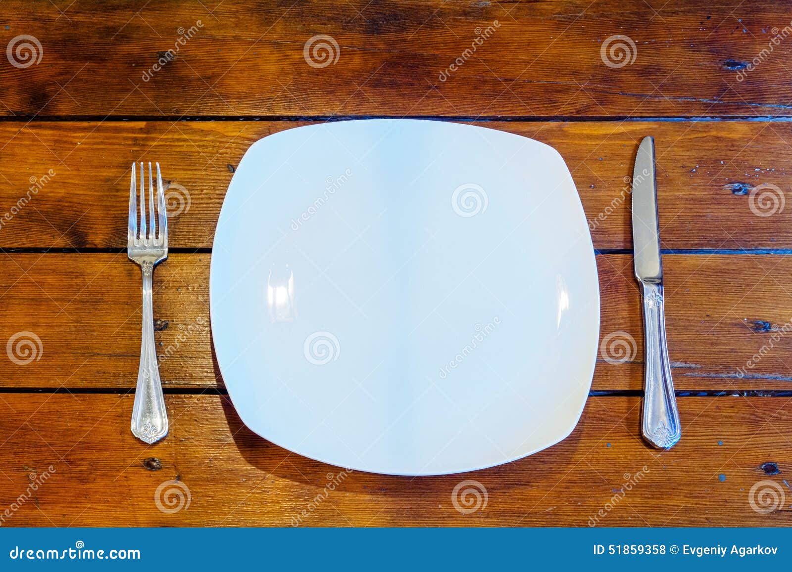 Plates And Cutlery On Wooden Table Stock Photo - Image ...