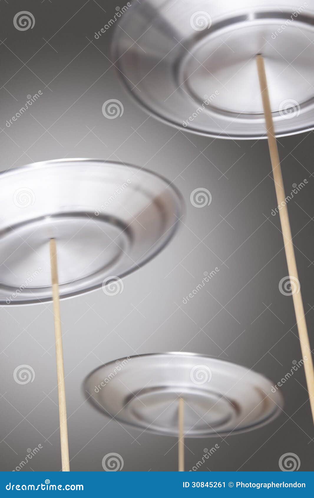 Plates Spinning on Sticks stock image. Image of twirling 30845261