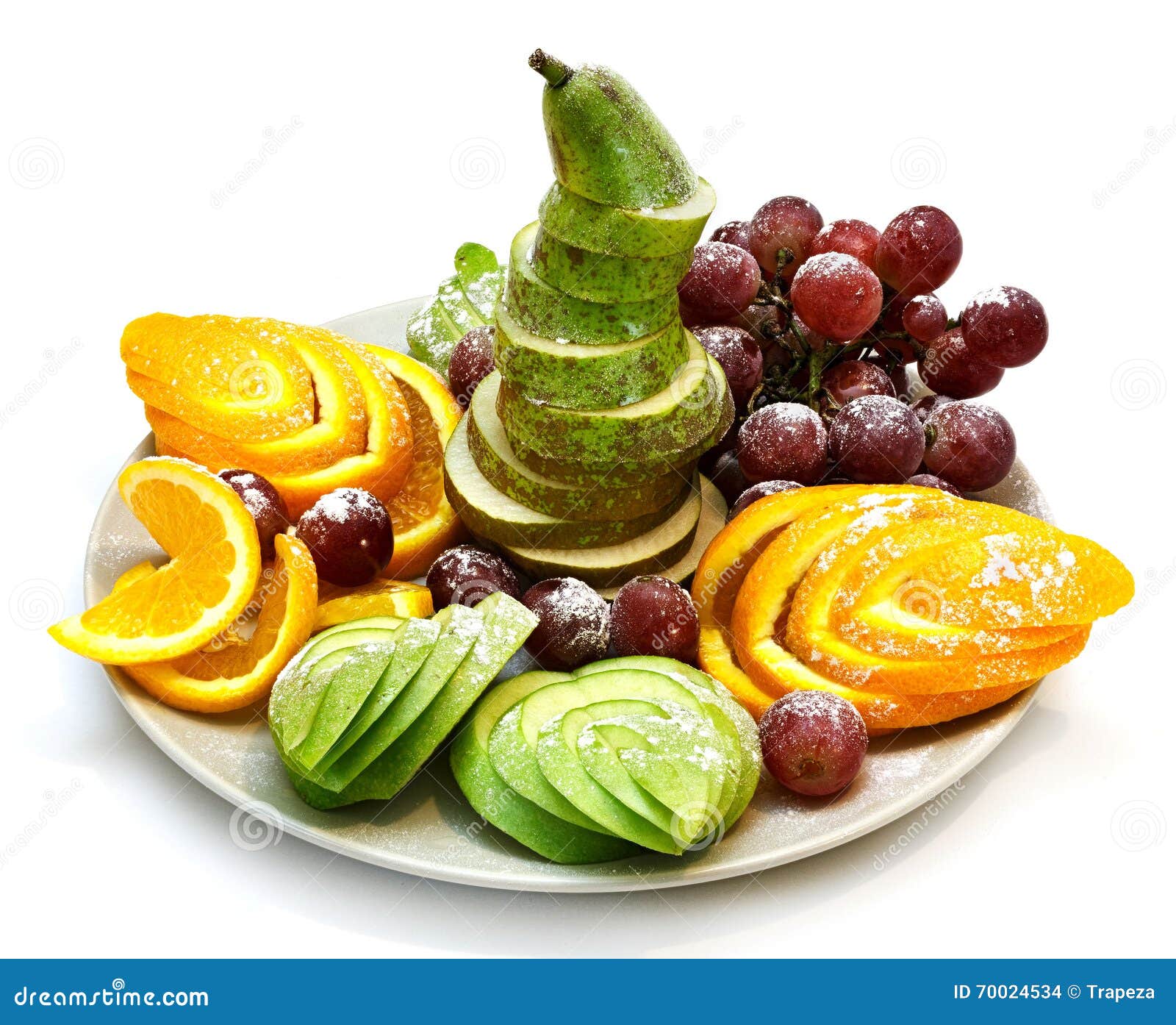platter of a assorted fresh fruit cut professionally on a white background