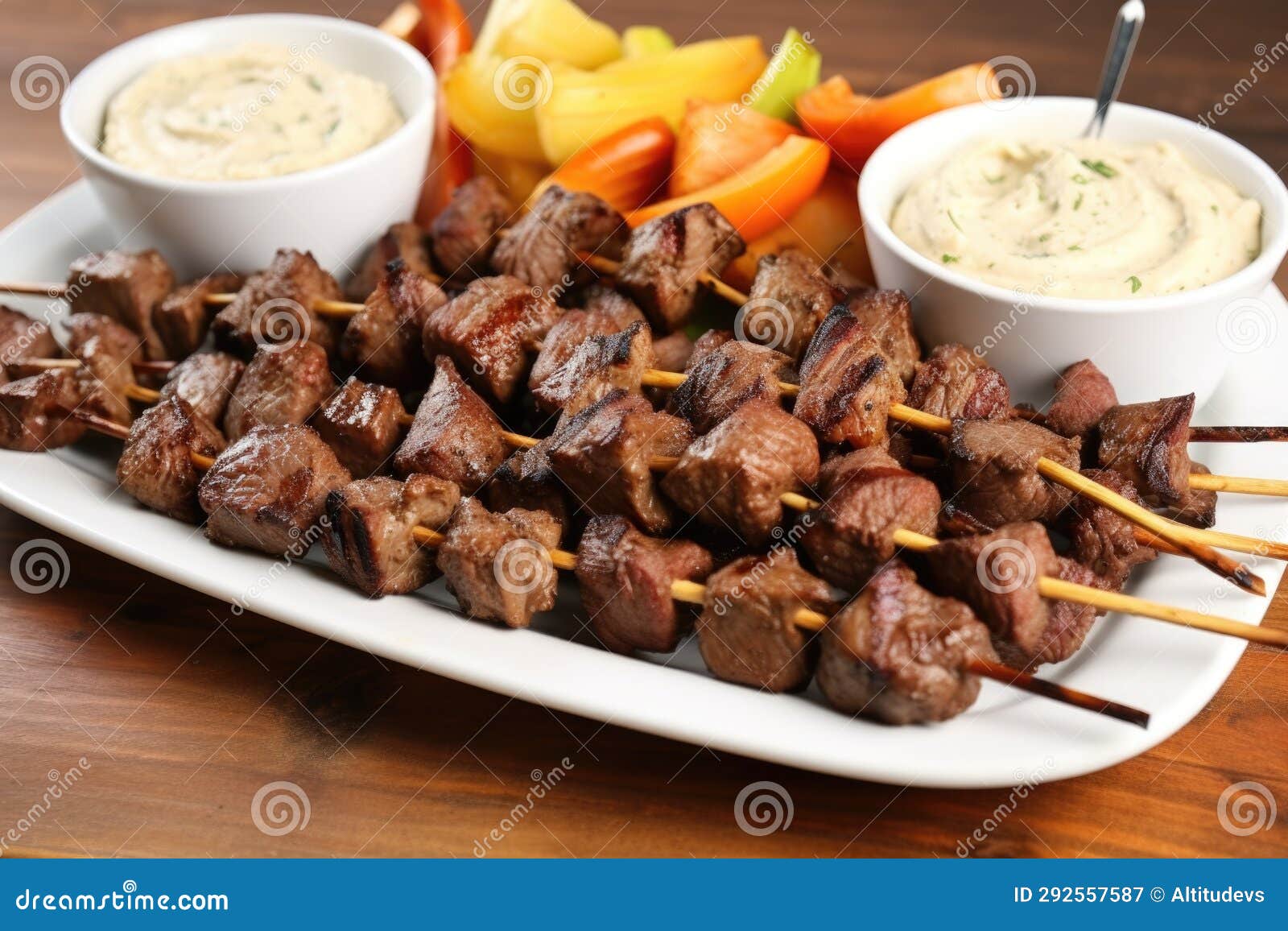 Platter of Cooked Steak Tips with Roasted Garlic Spread Stock Image