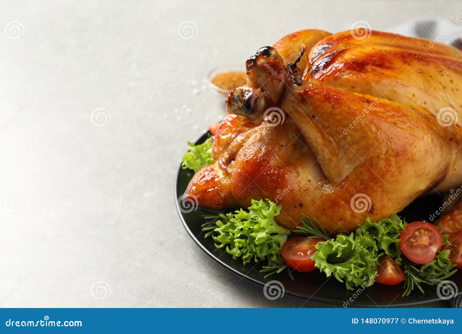 Platter of Cooked Turkey with Garnish on Table, Closeup Stock Image