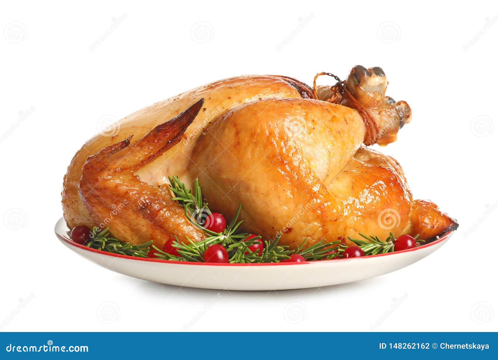 platter of cooked turkey with garnish on white