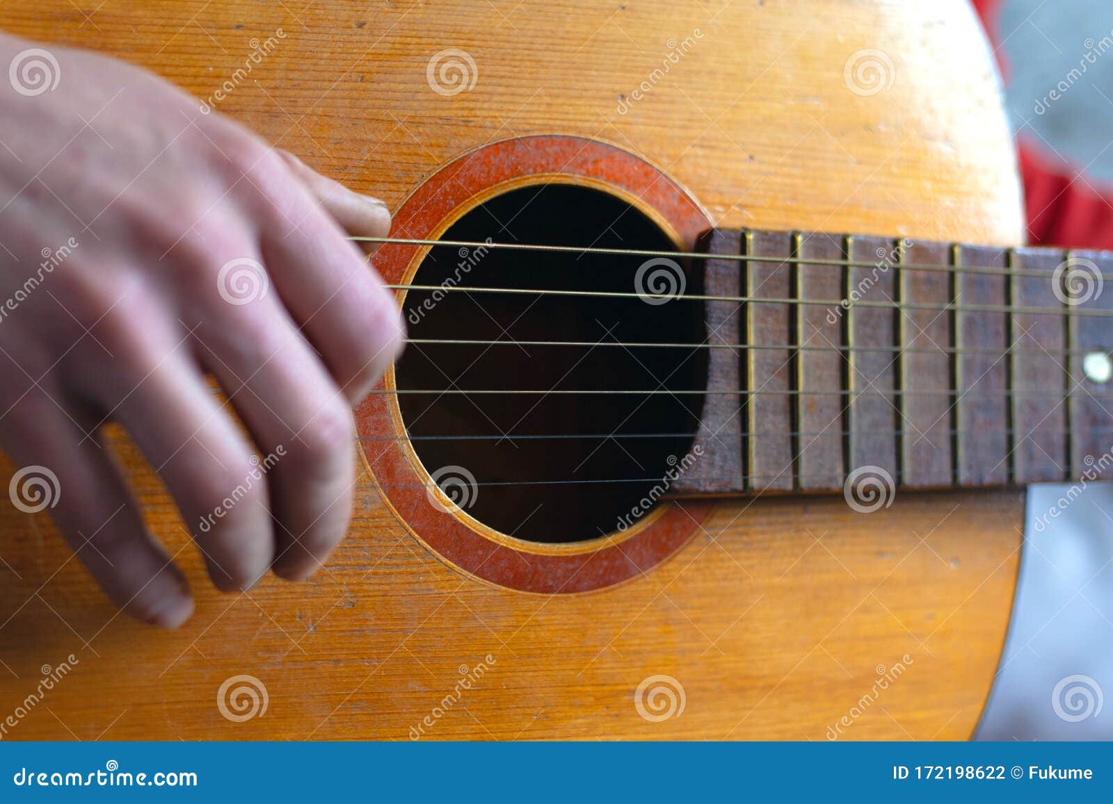 Play with Fingers Fingering Strings on a Classic Acoustic Guitar. Live
