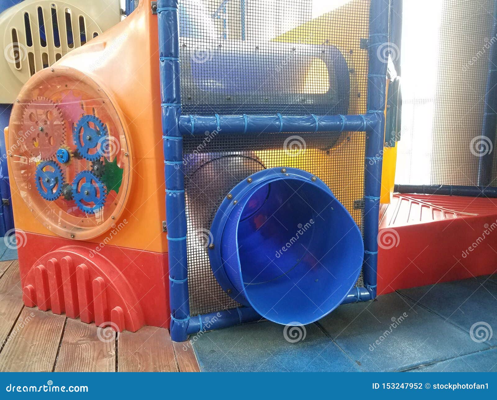 Play Structure with Netting and Blue Plastic Slide Stock Photo Image of slide, gears 153247952