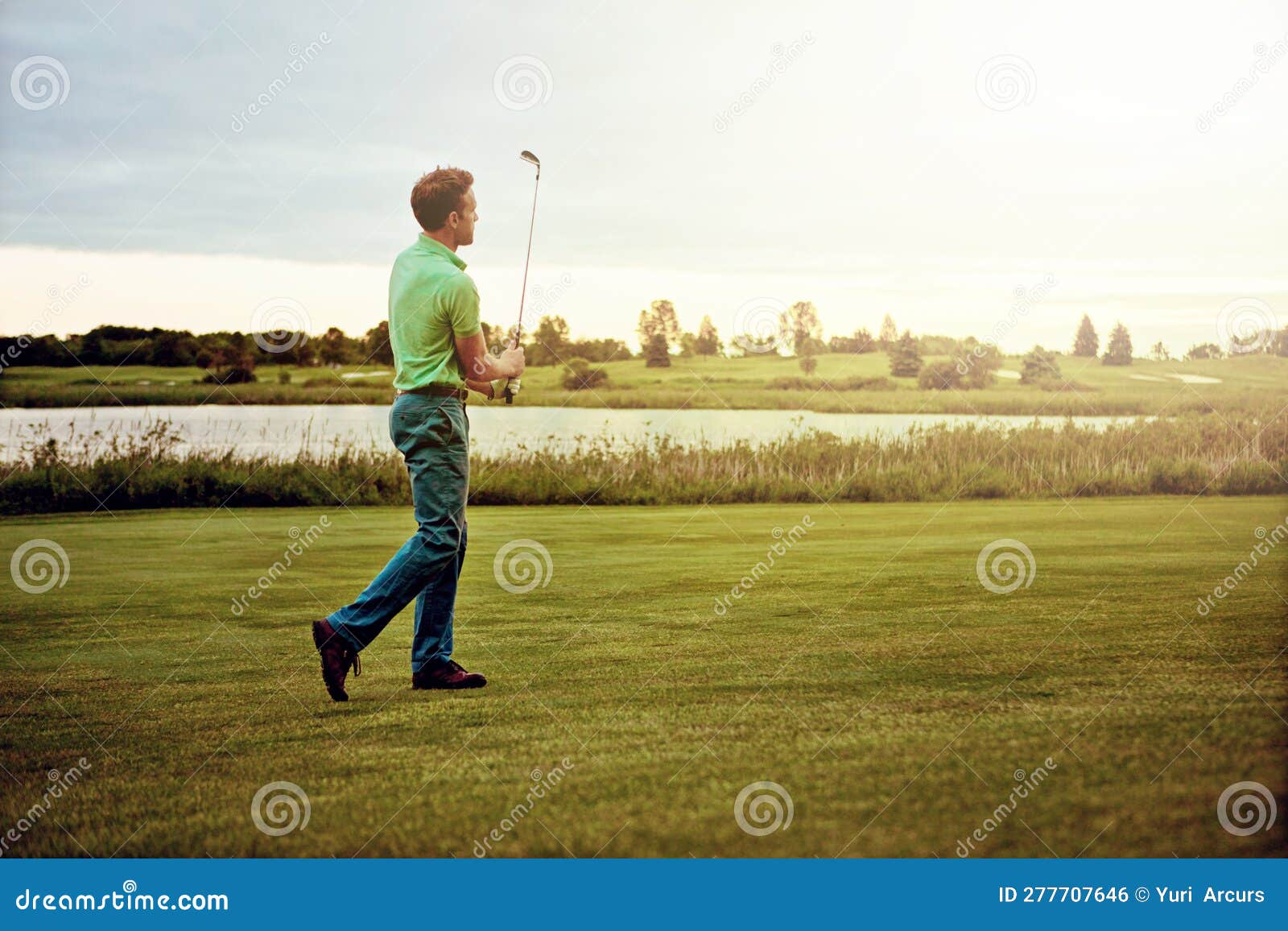 Played Like a Pro. a Man Practicing His Swing on the Golf Course. Stock