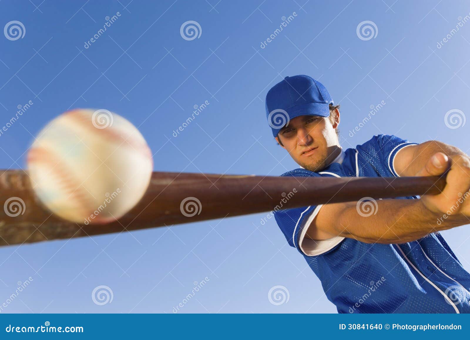Player Hitting Ball With Baseball Bat Stock Photo Image of sportswear