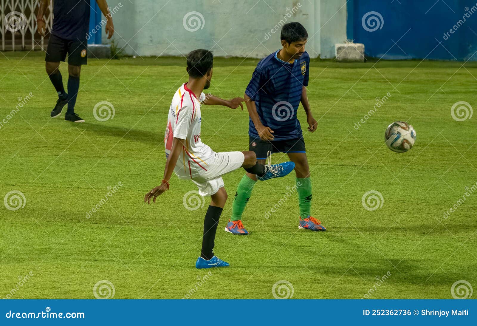Player Kicks Off the Ball in a Football Match Editorial Photo Image