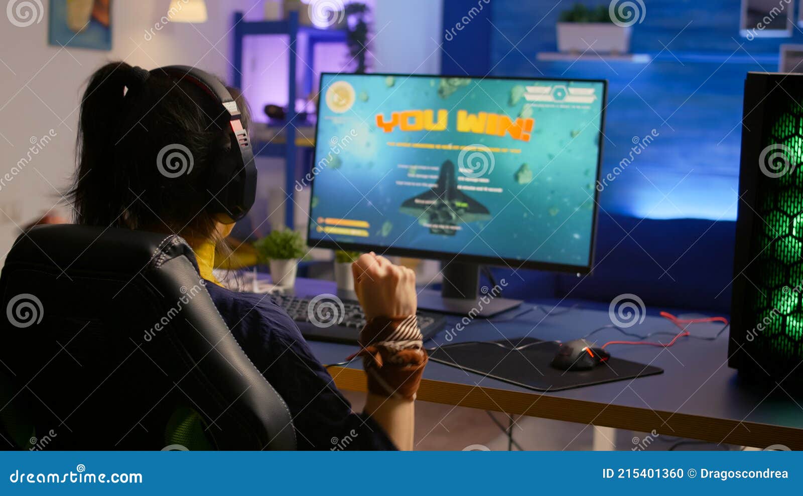 Premium Photo  Excited player winning an important virtual egame  competition of space shooter video game playing on powerful computer