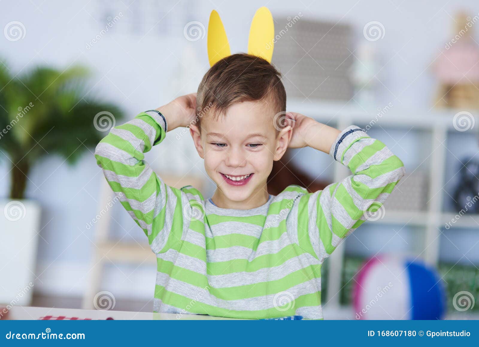 Happy boy with bunny ears stock photo. Image of animal - 168607180