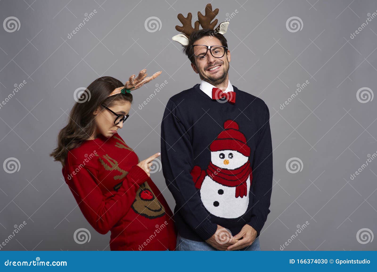 Playful Couple Posing in Christmas Clothes Stock Photo - Image of ...