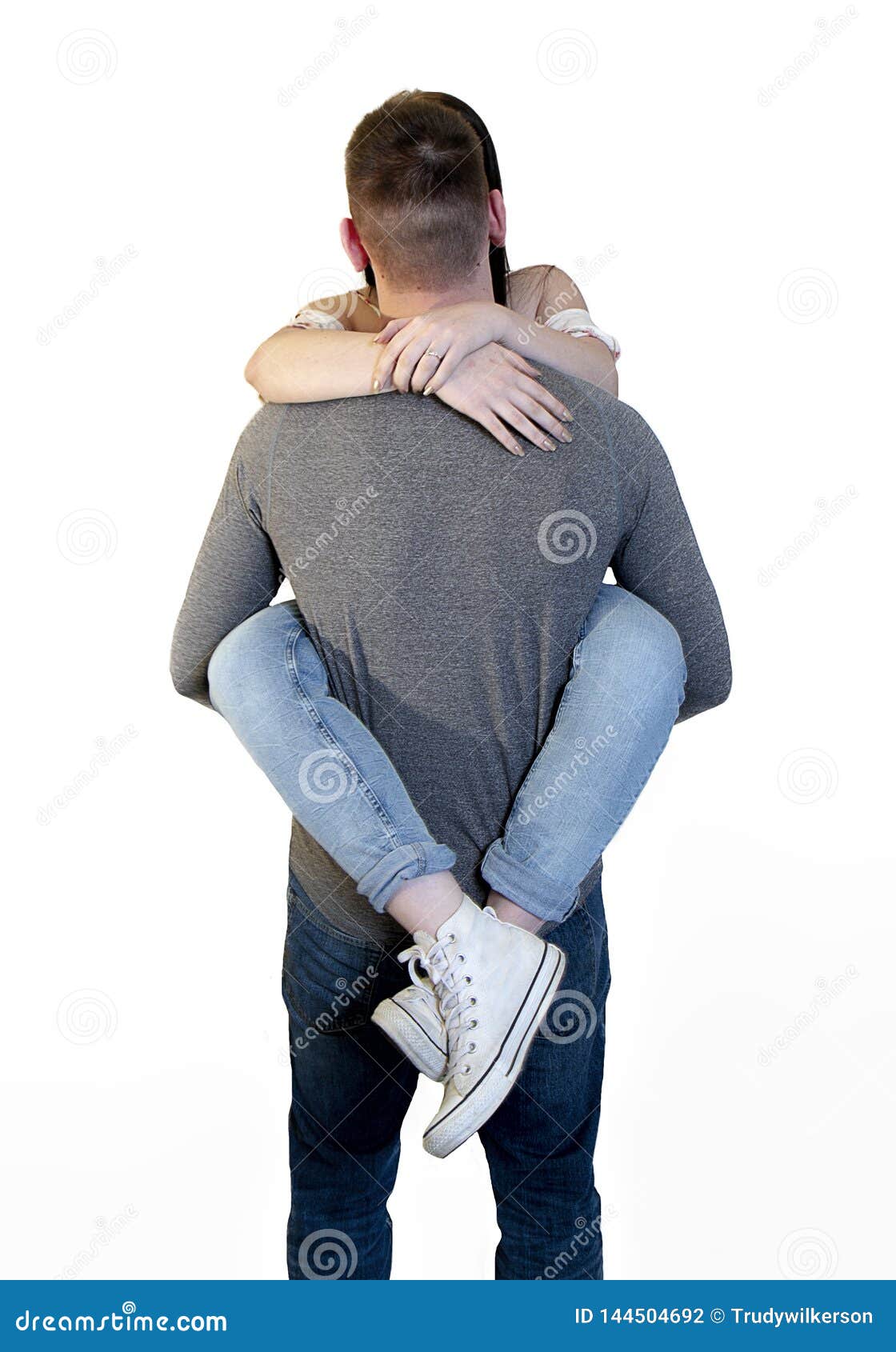 indarbejde pistol Hæl Playful Couple with Young Woman Wrapped Around Boyfriend`s Waist. Isolated  on White Stock Photo - Image of young, jeans: 144504692