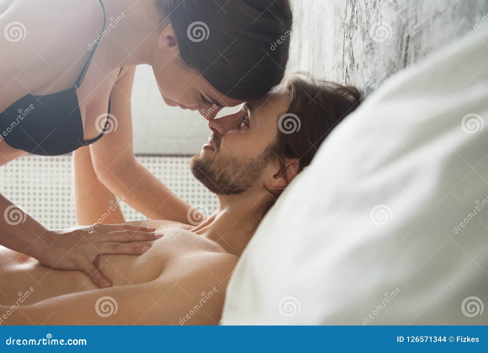 Romantic Couple Enjoy Sensual Foreplay before Sex in Bedroom Stock Photo picture