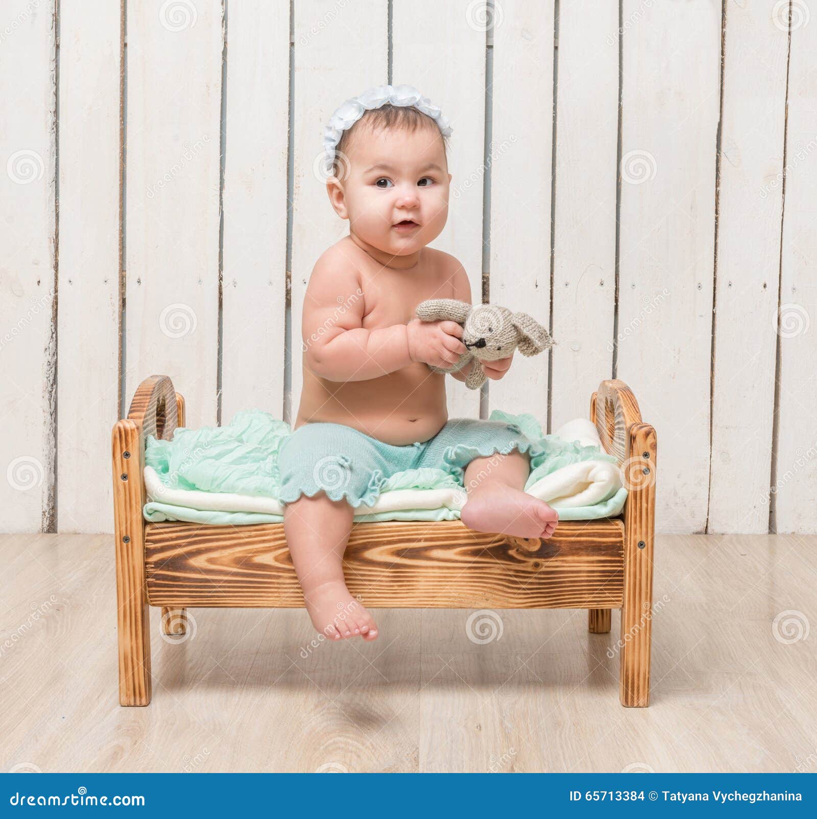 Playful Little Child Sitting on a Cot Stock Photo Image of portrait