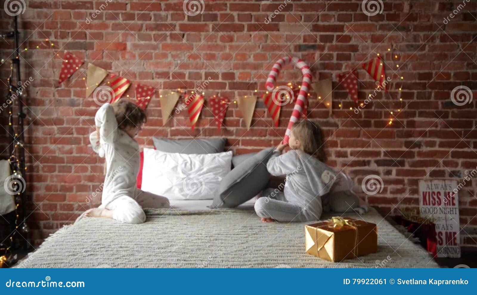 Playful Siblings In Warm Xmas Pajamas Fighting With Pillows At Home Brother And Sister Playing To her Christmas Stock Video Video of brother