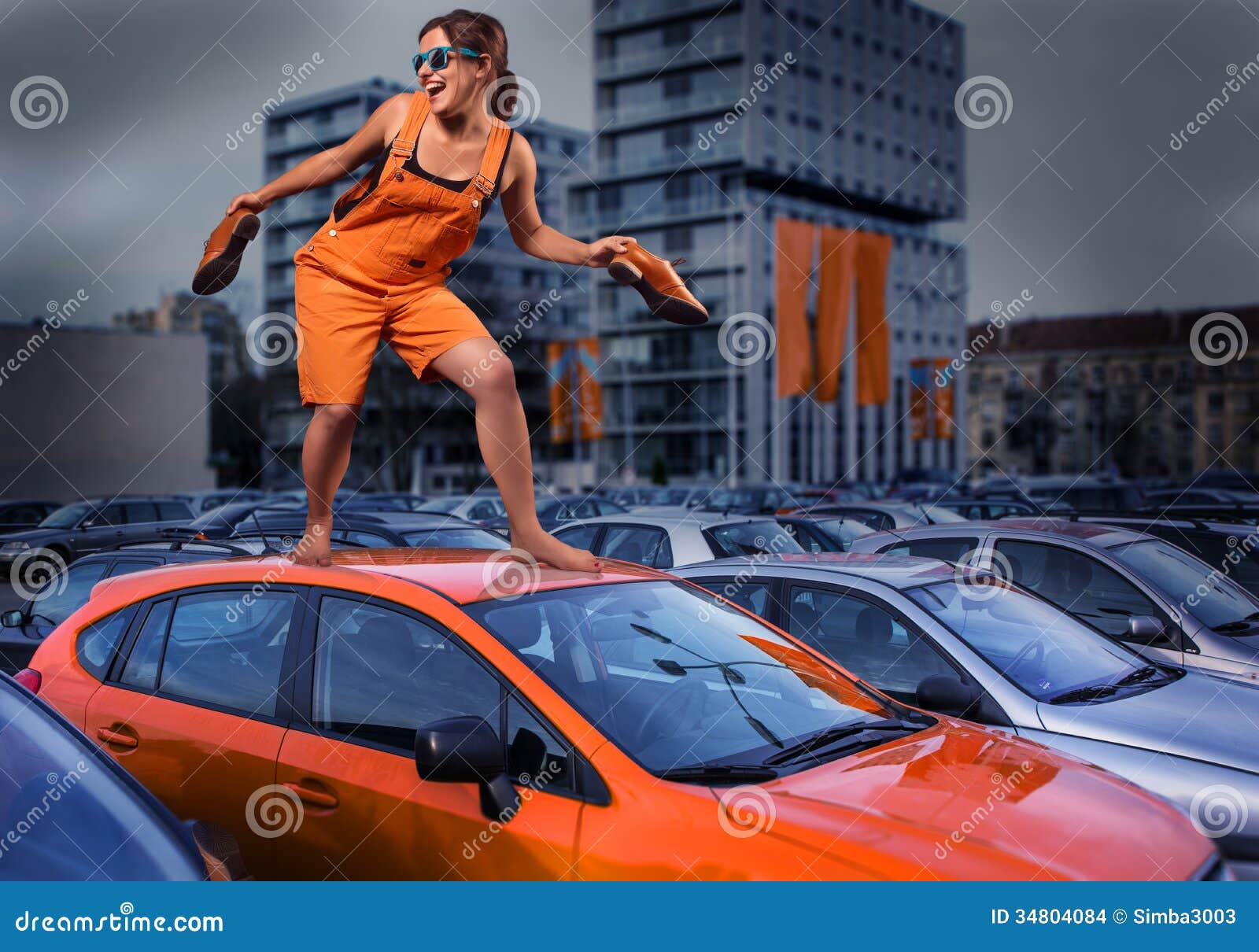 https://thumbs.dreamstime.com/z/playful-stylish-girl-orange-overalls-standing-car-roof-parking-lot-unique-person-young-dressed-barefoot-top-34804084.jpg