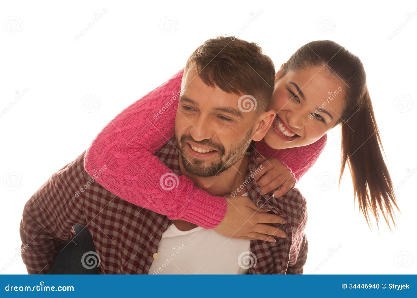 Playful Young Couple With Woman Riding Piggyback Stoc